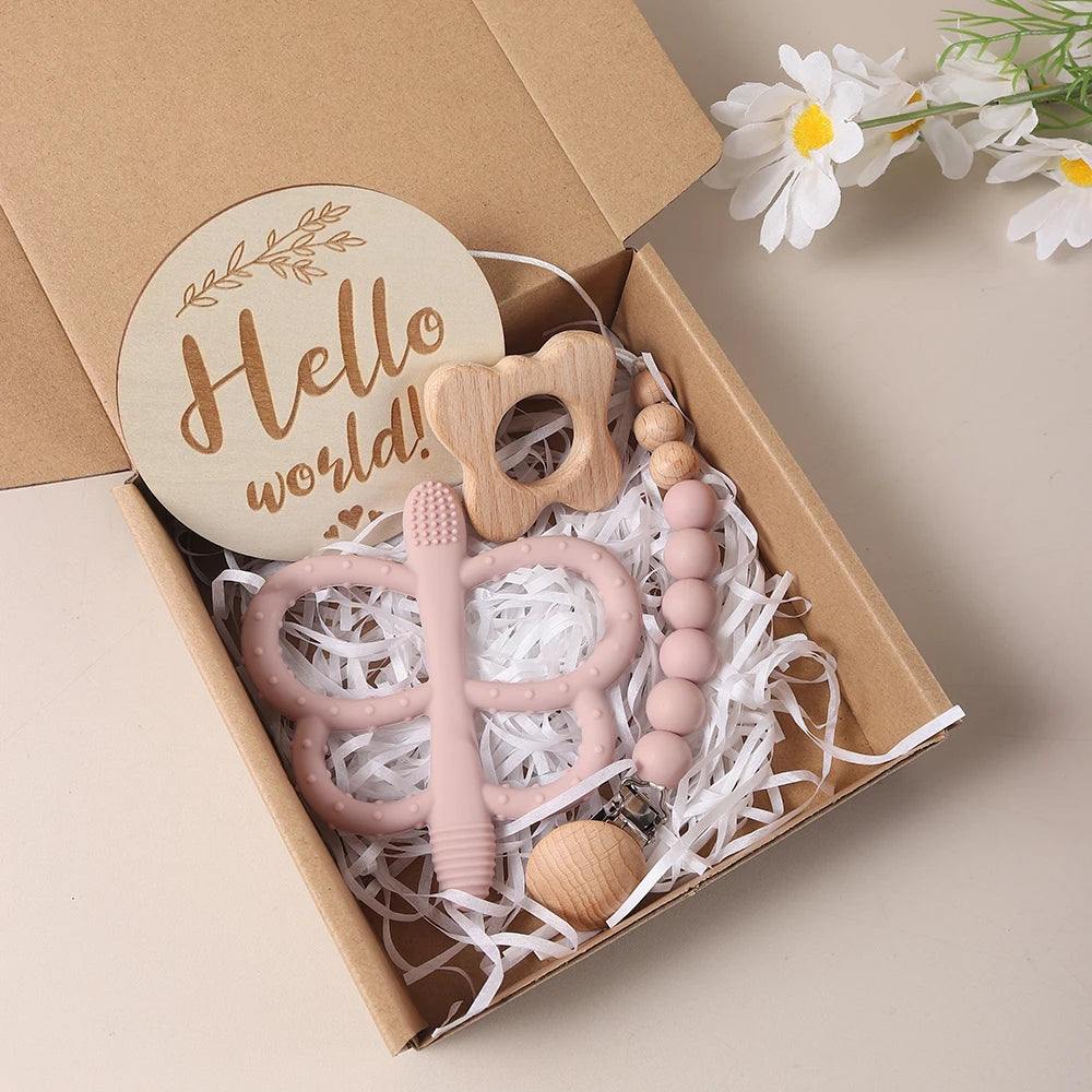Coffret cadeau naissance bois et silicone rose - Hochet éléphant, attache-tétine et disque Hello World Montessori

