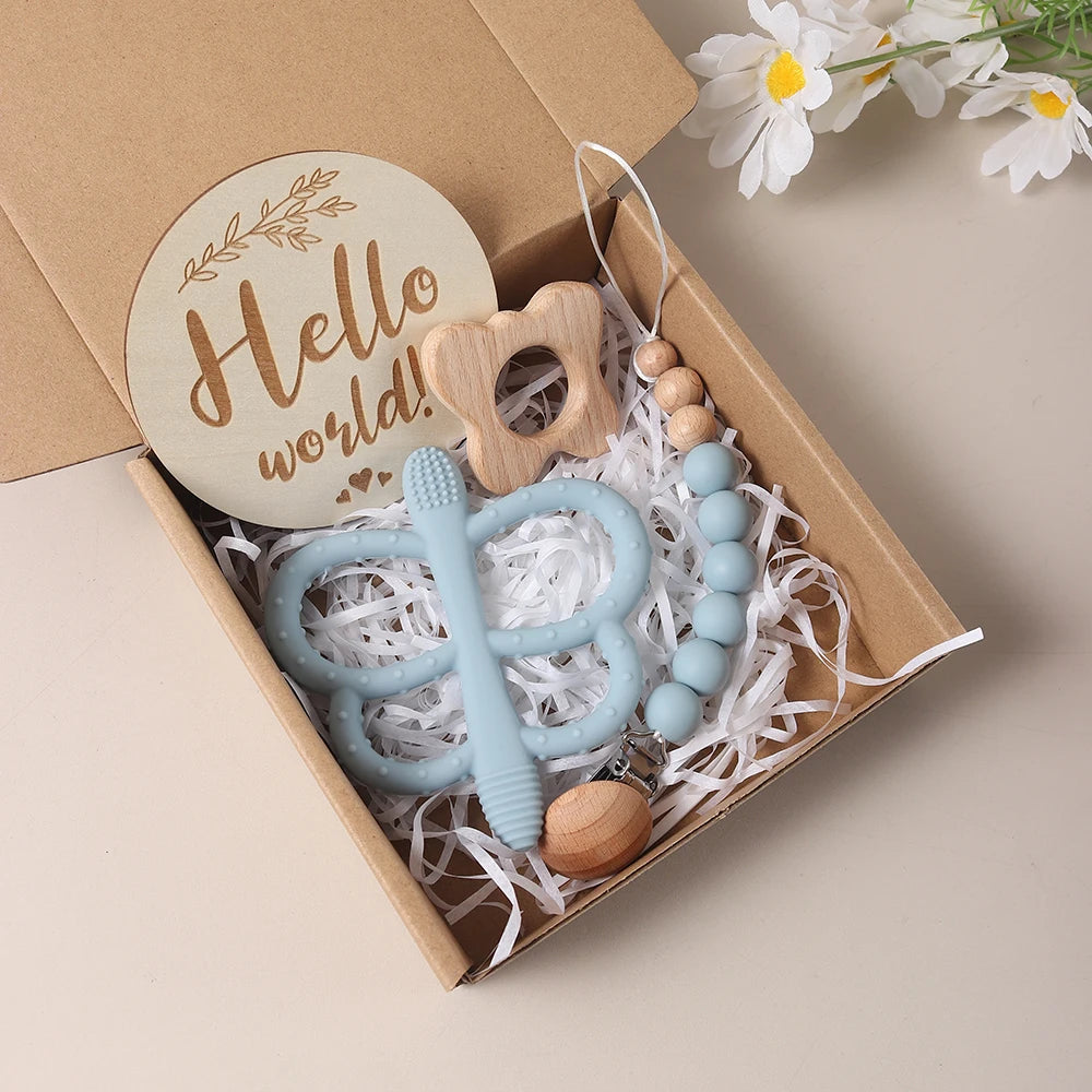 Coffret cadeau naissance bois et silicone bleu - Hochet éléphant, attache-tétine et disque Hello World Montessori
