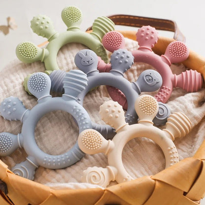 Anneau de dentition bébé en silicone alimentaire – Jouet sensoriel doux, soulage les gencives et favorise l’éveil - Nid’Éveil
